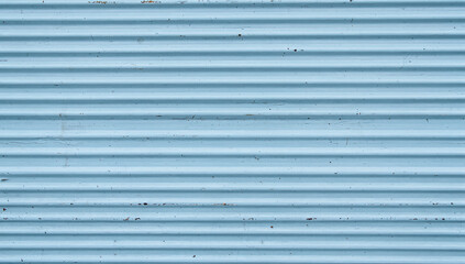 Corrugated metal sheet metal light blue painted surface horizontal