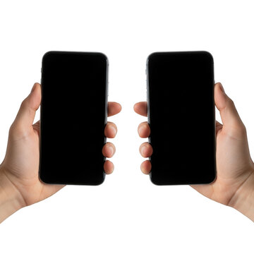 Hands holding two black smartphones with blank screens facing each other isolated on transparent background