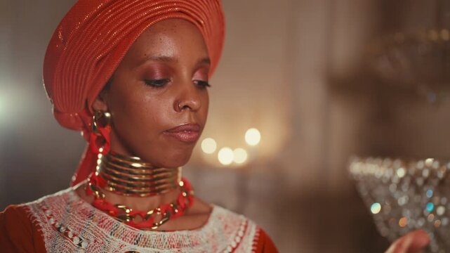 Female beauty and skincare, black lady in ethnic gown stroking her tender hands. Portrait of beautiful african princess enjoying hand cream with natural oils and organic ingredients in cosmetics