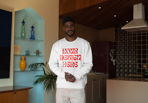 Mockup Of Man Dressed In Customized Sweatshirt At Home