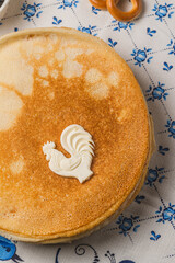 Pancakes on the table next to the samovar and caviar