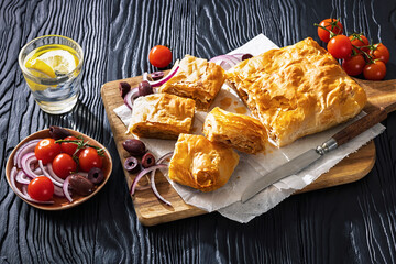 Greek savory sliced meat bougatsa pie with olives