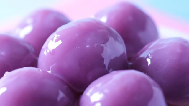 Ultra detailed close up video of chinese sweet taro ball dessert slow rotation macro food