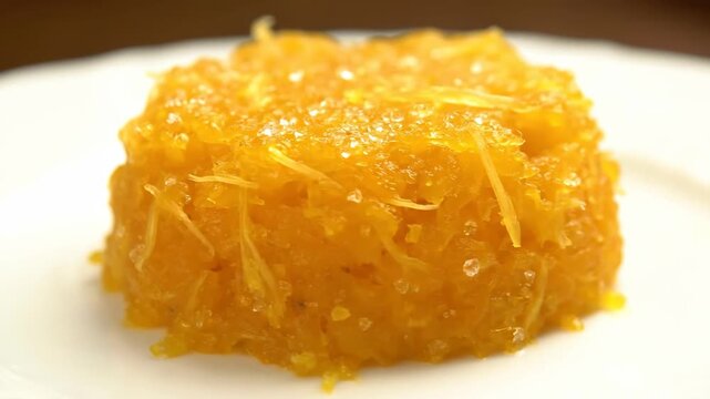 Delicious orange dessert on white plate