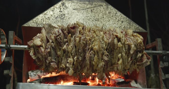 Traditional Turkish Cag Kebab Cooking Horizontally Over Wood Fire