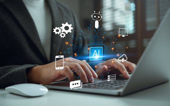 Businessman working on laptop with AI chip and digital circuit interface. Conceptual for artificial intelligence, machine learning, cloud computing, and automated robotic technology solutions.