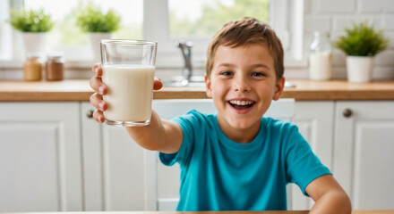 Boy drinking milk with a bright smile showing healthy lifestyle