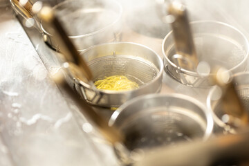 Chef Preparing Ramen in Japanese Noodle Shop with Steam Rising