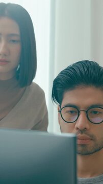 Vertical Screen : Group Adult Asia male female freelance meeting write prompt AI bot app program nomad, video game, talk strategy, discuss plan, user interface, designer, big data on desktop computer.