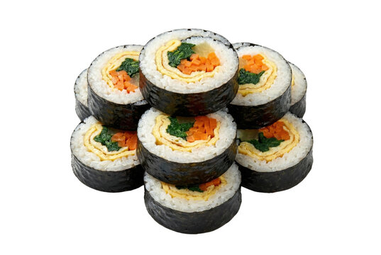 Seaweed rice rolls filled with egg and vegetables stacked isolated. Korean gimbap traditional meal.