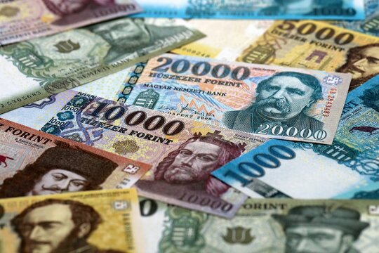 Hungarian forint money bills pile on table. Hungary banknotes of HUF currency close up.