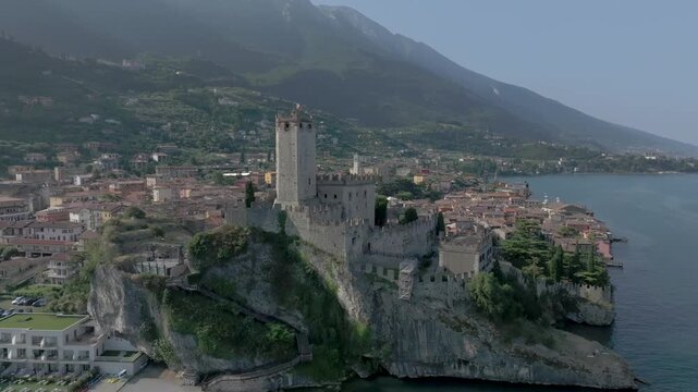 Europe Italy Lake Garda Malcesine Castle Aerial View with Drone 4K 60fps Summer time sunrise