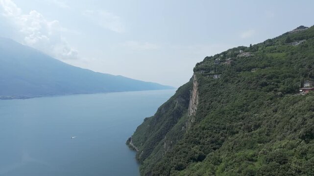 Europe Italy at Lake Garda Aerial View over the Lake with Mountains and CLIFFS 4K 60fps Cinematic