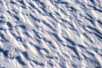 Texture of the small snowdrifts on the ground