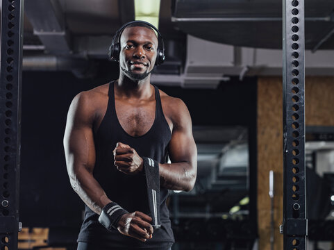 Athlete standing in gym, preparing for training
