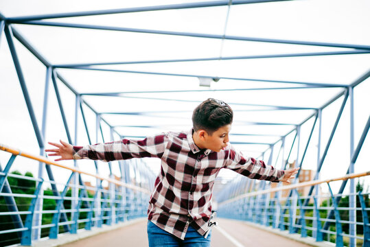 Gypsy boy singing flamenco on a bridge