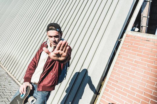 Portrait of young man gesturing