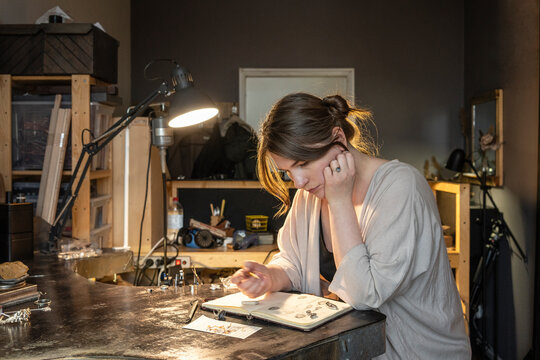 Jewelery designer working on design plans