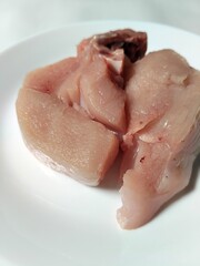 Fototapeta premium Chicken pieces on a plate, a basic ingredient in a food menu.