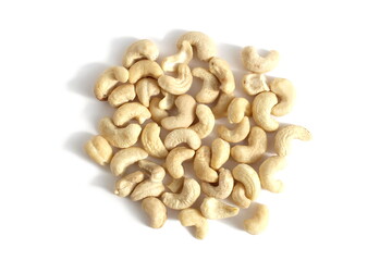 A pile of cashew nuts lies on a white background.