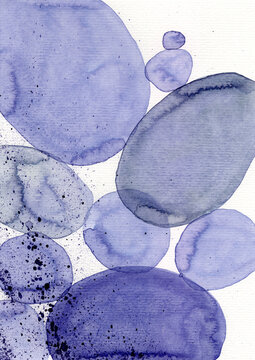 Abstract blue watercolor forms on paper with copy space