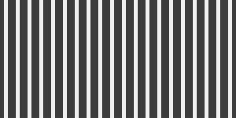Obraz premium Sleek, minimalist black and white vertical stripes pattern. Perfect for backgrounds, website design, or textile prints. Clean, modern aesthetic conveys simplicity, order, and sophistication.