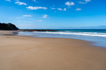 Sandy shore and ocean waves at Apollo Bay Beach, Australia