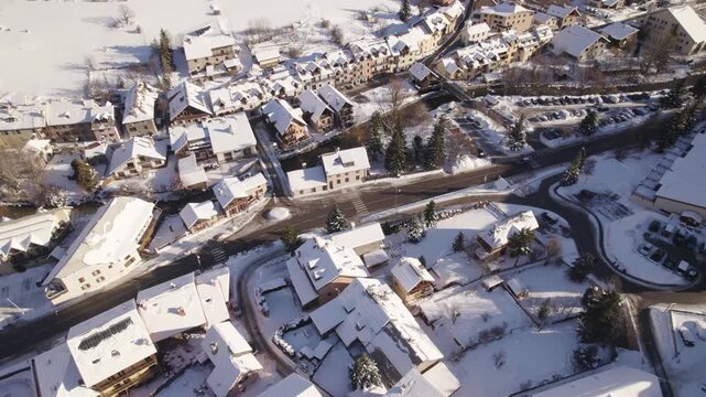 Alpine Village Infrastructure in Winter, Serre Chevalier Resort with Roads and Parking, Snow-Covered Chalets - Aerial Drone Shot