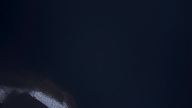 A Birdseye of Loch Ness Shores in Scotland, mostly Blue water with some Lough shores appearing.