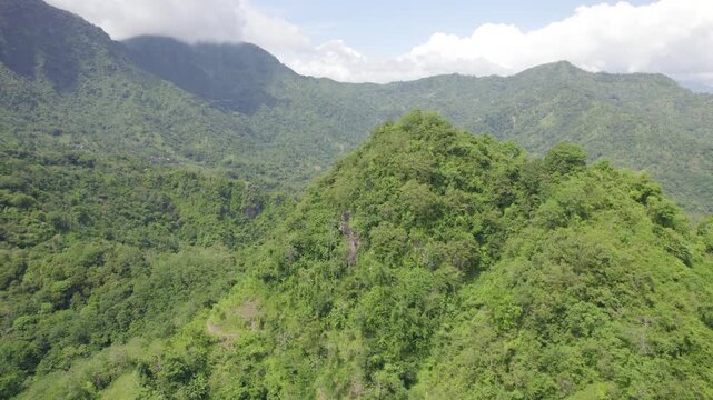 Aerial Reveals Remote Balinese Village Hidden Among Lush Tropical Jungle and Mountain Valley Landscape &ndash; Drone View
