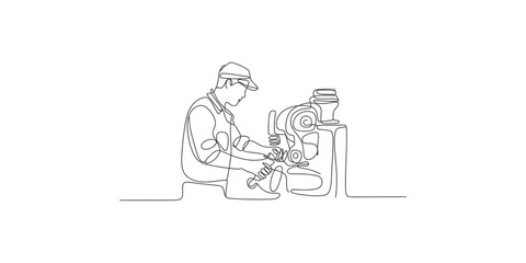 Fototapeta premium One line drawing of a factory worker operating an industrial machine in a workshop