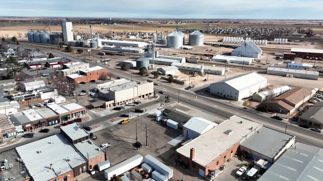 Agricultural pan shot showing silos and grain elevators on the East half of town 2026.