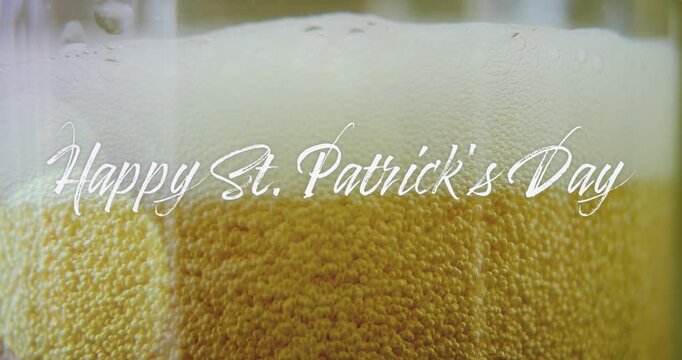 Camera opening closeup pint amber beer bubbles rising foam settling text fading for St Patricks Day