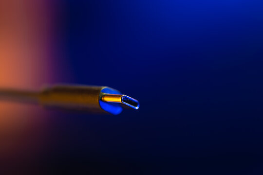 Macro type c connector in neon light. Usb c plug.
