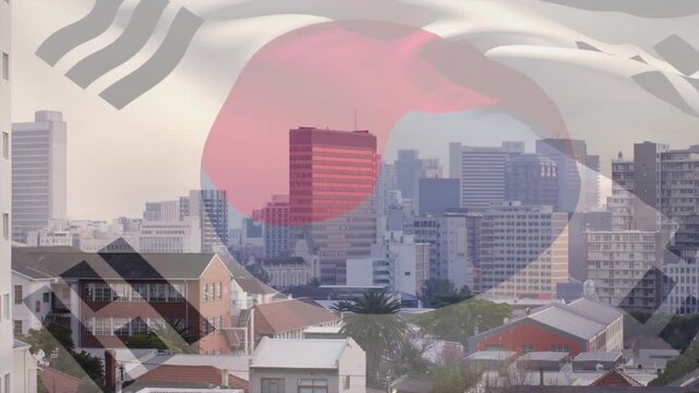 South Korean flag rippling over city skyline on breeze, overlaying skyline and shifting taegeuk