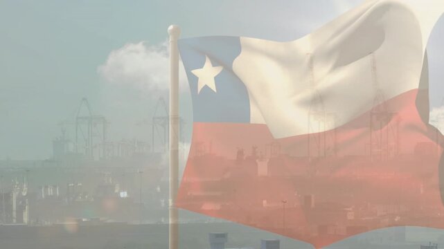 Breeze picking up, flag on pole lifting and rippling, harbor silhouettes showing through fabric