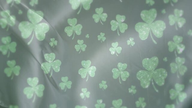 Silk fabric rippling from subtle motion, folds shifting as highlights gliding, showing clover print