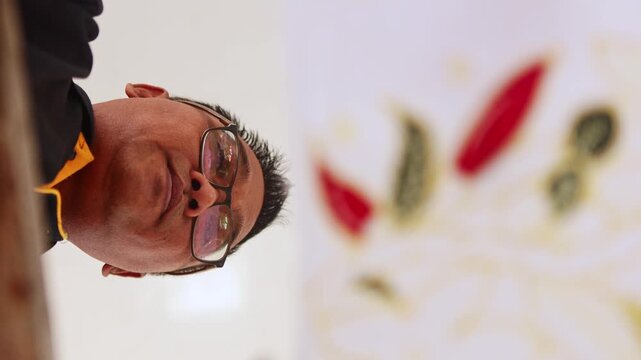 Artisan creating a traditional Indonesian batik textile