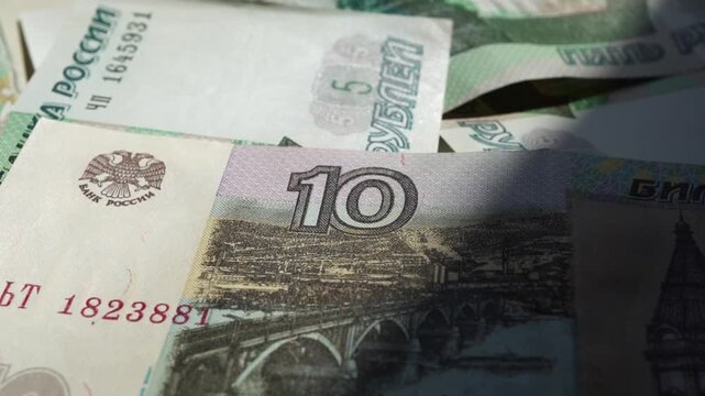 Paper banknotes of Russian rubles in a stack. Paper banknotes of Russian rubles of different denominations in a stack close-up