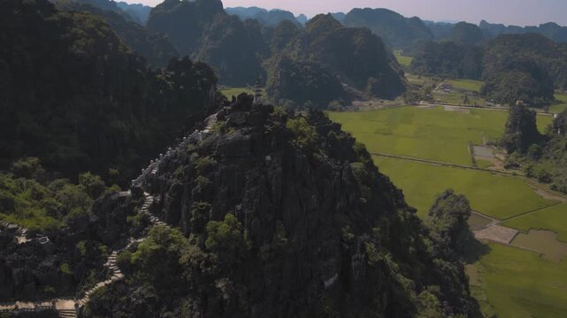 Breathtaking aerial footage flying over the hang mua peak viewpoint in tam coc, ninh binh, vietnam