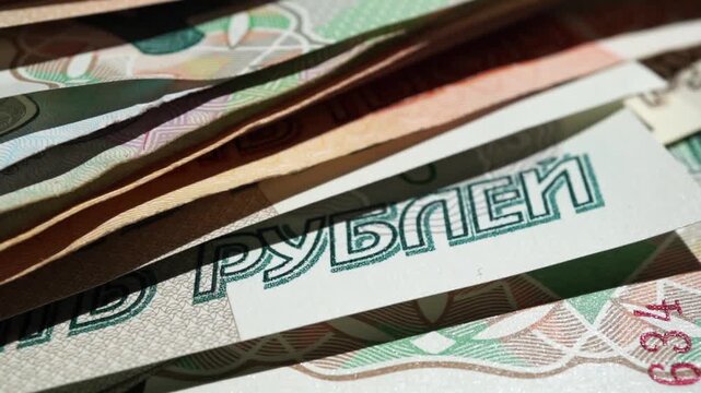 Paper banknotes of Russian rubles in a stack. Paper banknotes of Russian rubles of different denominations in a stack close-up