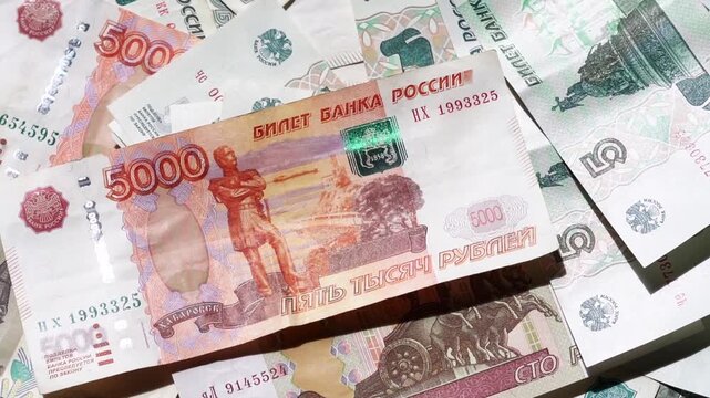 Paper banknotes of Russian rubles in a stack. Paper banknotes of Russian rubles of different denominations in a stack close-up
