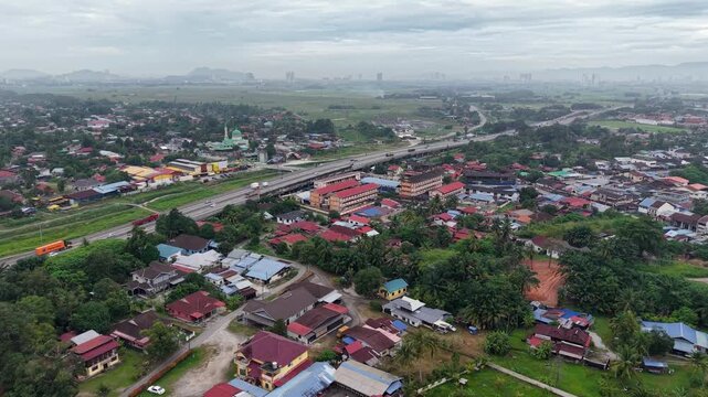 Aerial drone view of Kubang Semang town and highway