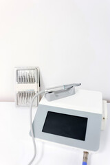 Dental equipment and set of tools placed on table in bright office.