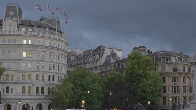 Static long clip of South African High Commission and buildings on Strand with Union Flags flying. Shot on an early autumn evening at twilight