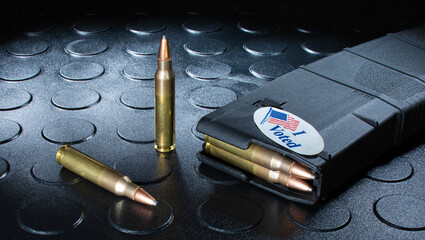 AR-15 magazine loaded with ammo wearing an I voted sticker
