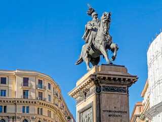 Fototapeta premium Historical grandeur in Naples. A low-angle perspective of the Vittorio Emanuele II monument, showcasing intricate bronze textures and 19th-century commemorative art.