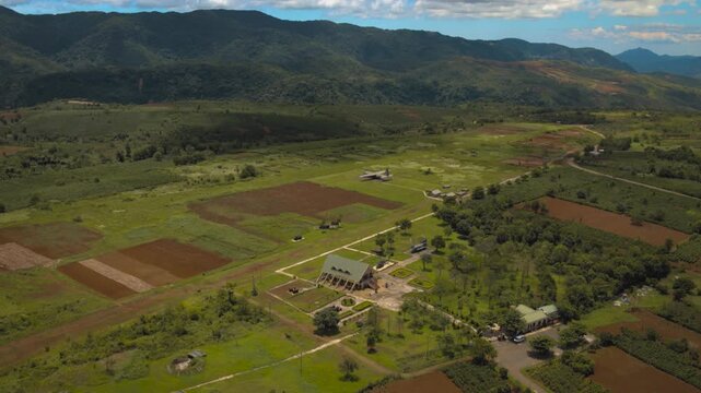 Aerial perspective of the historic khe sanh combat base and airfield surrounded by mountains