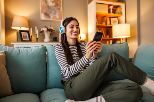 Woman taking online foreign language course using smart phone
