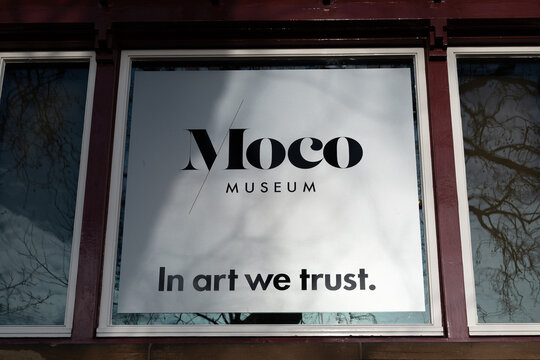 Moco museum logo and slogan 'in art we trust'